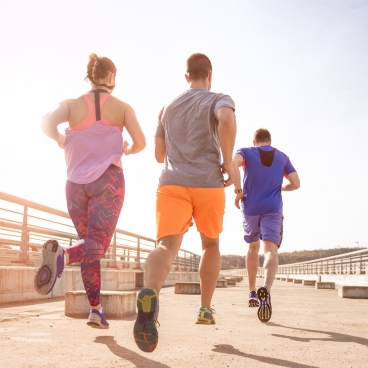 3 people running on a track- cardio supplements