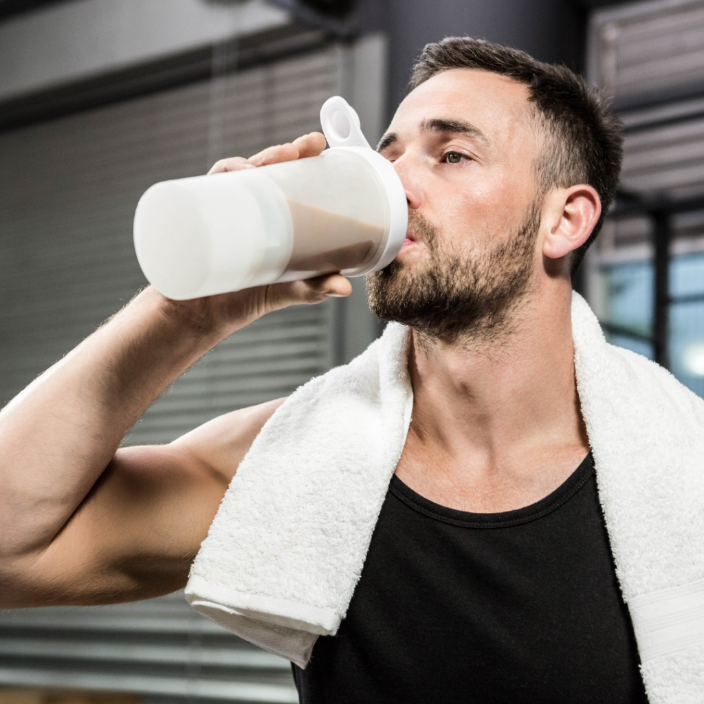 man drinking a low calorie protein powder chocolate shake from a bottle